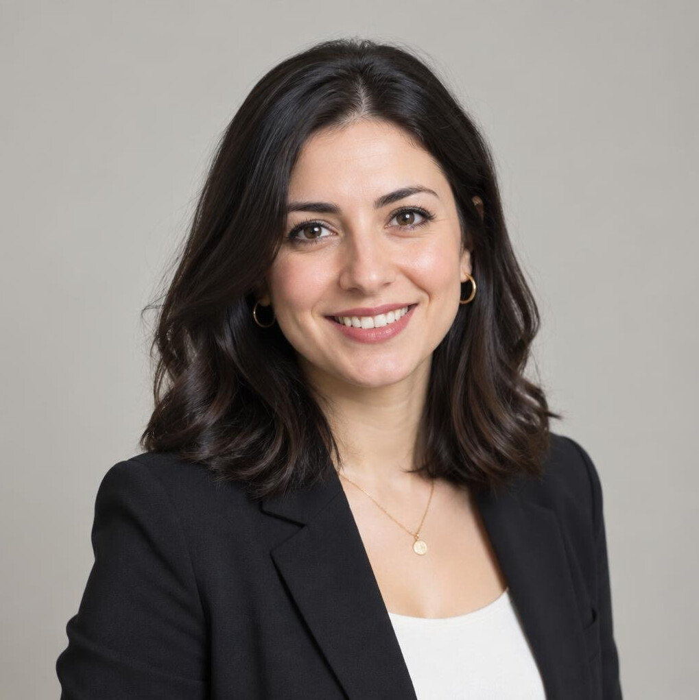 Studio portrait of a young Turkish female journalist smiling