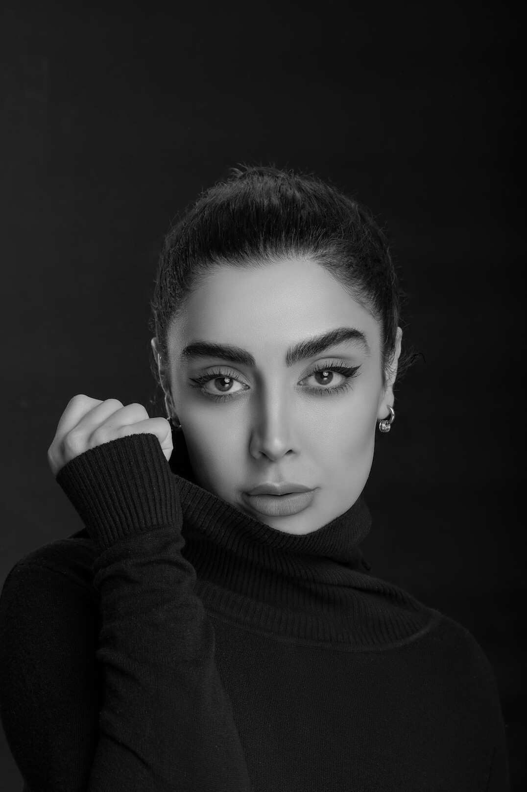 Studio portrait of a Turkish female society editor