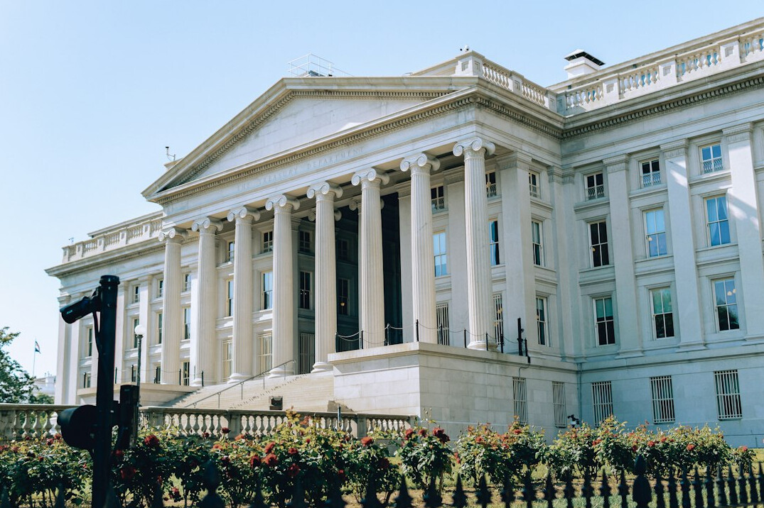 Grand government building with columns under daylight